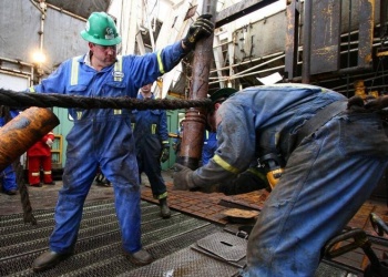 Precision Drilling урегулировала 15-летний спор об оплате времени на надевание СИЗ